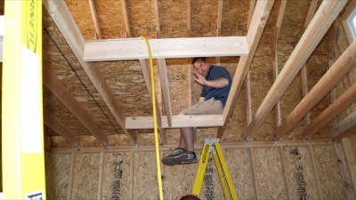 With the roof framing done and loft boards in place, the roof can be 