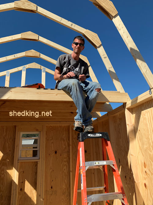 Picture of Dan with his 10x12 barn shed sitting in loft Picture of Dan with his 10x12 barn shed sitting in loft