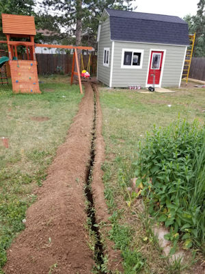 The outside of Erik's home office shed