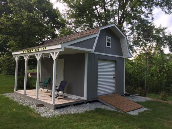 Garage shed ideas showing the outside of shed with roll up door