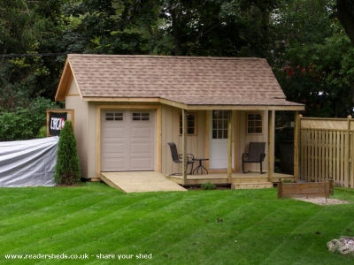 Here's a nice garage shed idea also with storage shed on side