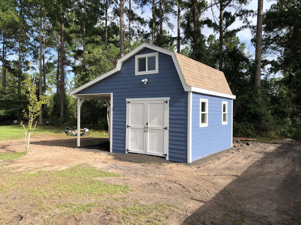 Jeff's 12x16 barn with covered porch area. Jeffs 12x16 barn shed picture with additional windows added to the side.