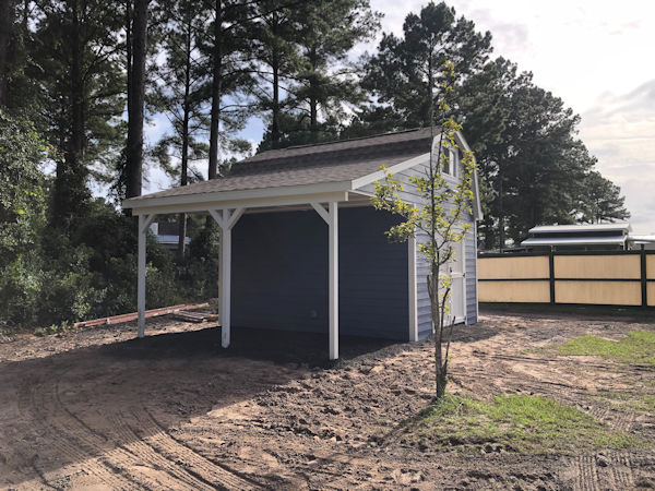 Shed picture of the side roof covered area of Jeff's 12x16 barn shed. Nice view of Jeff's barn shed showing the side porch area.