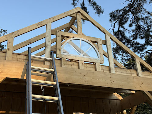 Impressive framing for Kates half moon window installation