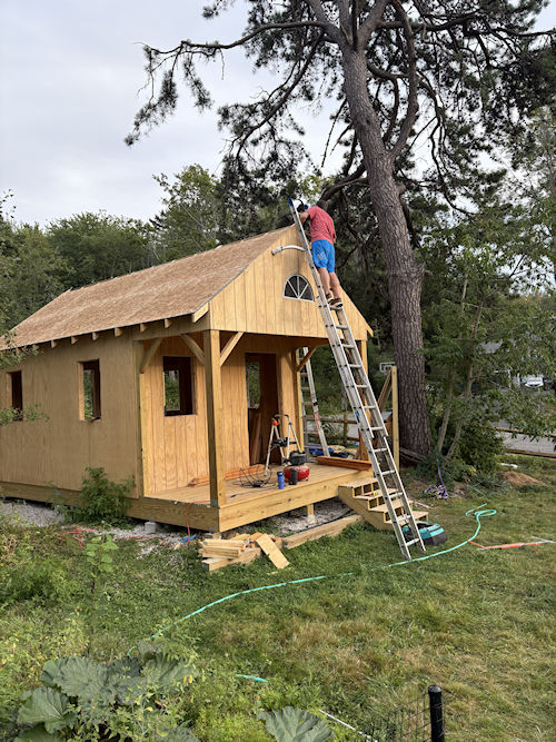 Kate hired subs for her roof work
