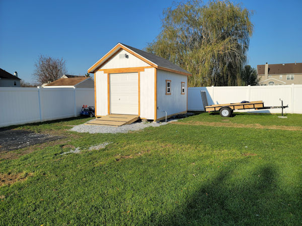 Parrish used my 12x16 gable garage shed plans to build this neat shed. a picture of Parrish's 12'x16' gable shed with roll up shed door.