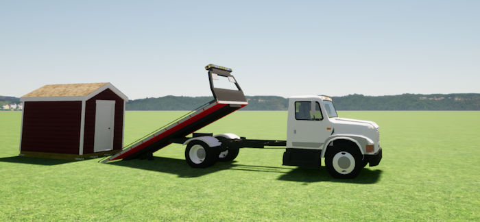 hauling a portable shed on a flatbed truck