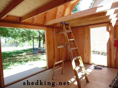 this tiny house has a sleeping area in the loft, small