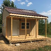 A picture of Tim's nice big front porch on his off grid cabin. Picture of Tim's off grid cabin with nice big front porch.